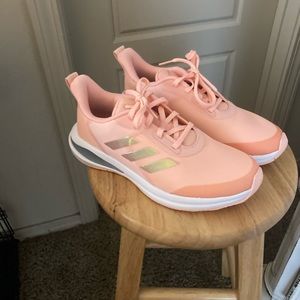 Adidas tennis shoes, melon/peach color, never been worn, rubs slightly big